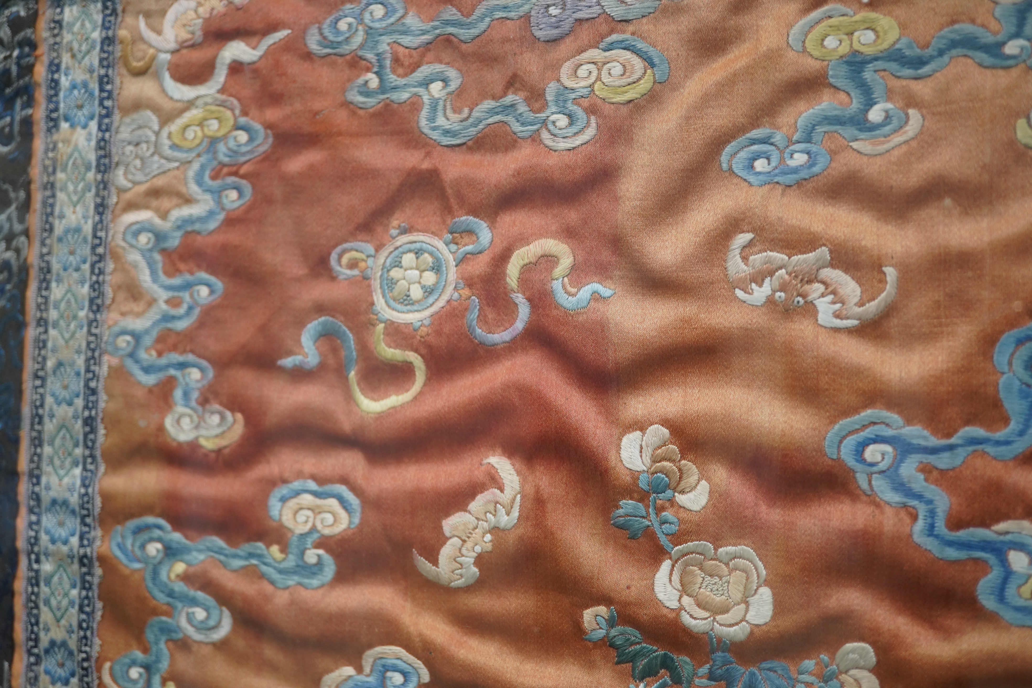 A pair of Chinese coral silk ‘dragon’ panels, 19th century